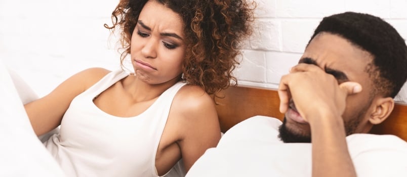 Woman In Bed Looking Under Blanket, Man With Erectile Dysfunction