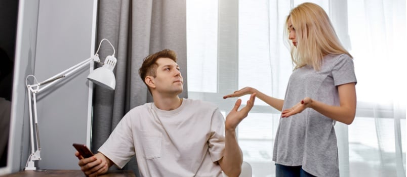 Woman expressing dissatisfaction to lazy husband