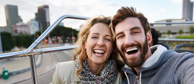 American Beautiful Couple Loudly Laughing Top On The Bus Floor While Exploring City