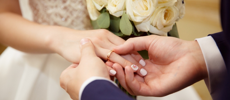 Man Wearing A Ring In The Girl's Hand Closeup Photo