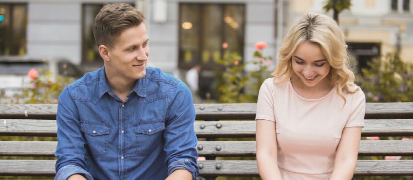 Wonderfull Couple Sitting On Bench In Caffe Lady Shying First Date Concept