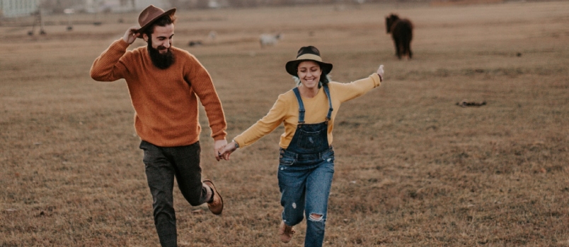 Man Holding Woman Hand And Running In The Ground Express Happiness Freedom