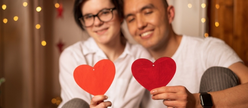couple holding hearts in their hands