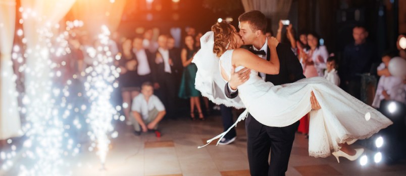 Groom Holds The Bride In His Lap And Kissing To Lady