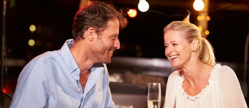 Happy Attractive Couple Dating Together At Cafe With Glass Of Beers