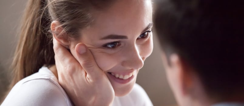 Portrait Of Smiling Woman Touched Stroked By Male Hand. Tender Relationship Loving People