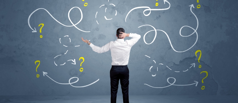 A Salesman In Doubt Can Not Find The Solution To The Problem Concept With Curvy Lined Arrows And Question Marks Drawn On Urban Wall