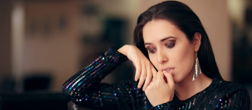 Sad Bored Glamorous Woman Having No Fun At Party Sitting Alone And Biting Her Nails