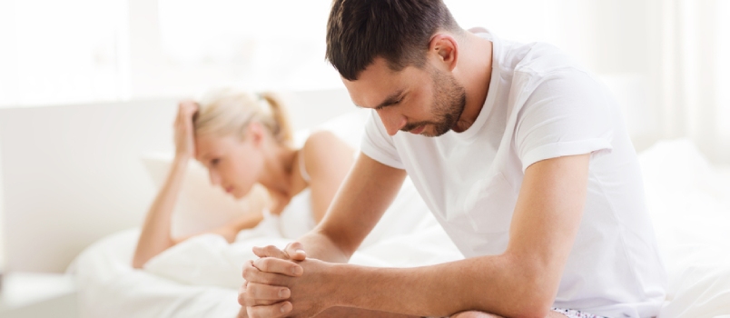 Unhappy Couple Having Problems At Bedroom
