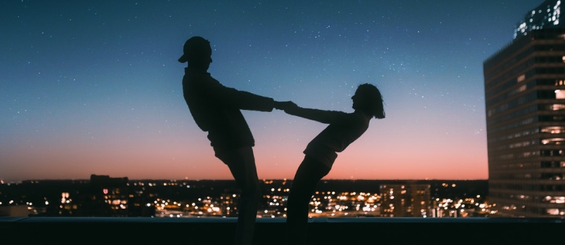 Silhouette Of Man Jumping On The Field During Night Time