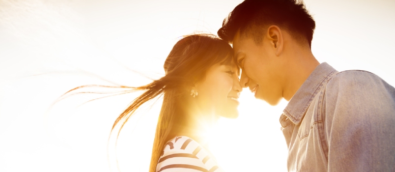 Man Kissing Women On The Forehead