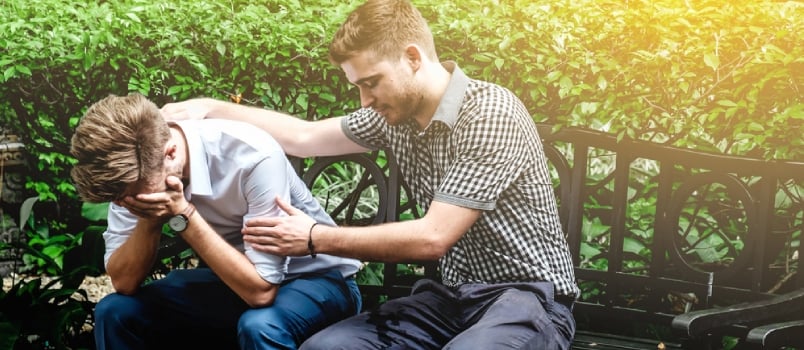 Upset Couple Sitting Together Outdoor At Bench Showing Empathy To The Second Partner