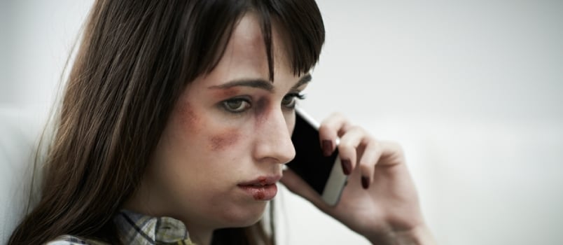 Female Victim Of Domestic Abuse Phoning Support Group