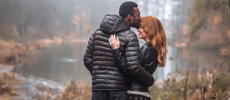 Interracial Couple Posing In Autumn Leaves Background, Black Man And White Redhead Woman