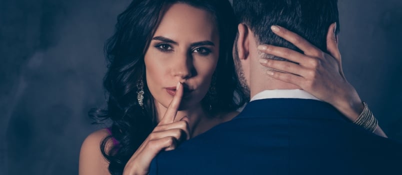 Shh! Portrait Of Tempting Brunette Lady Showing Silence Sign With Forefinger Touching Secret Mysterious Gentlemen With Rear View,