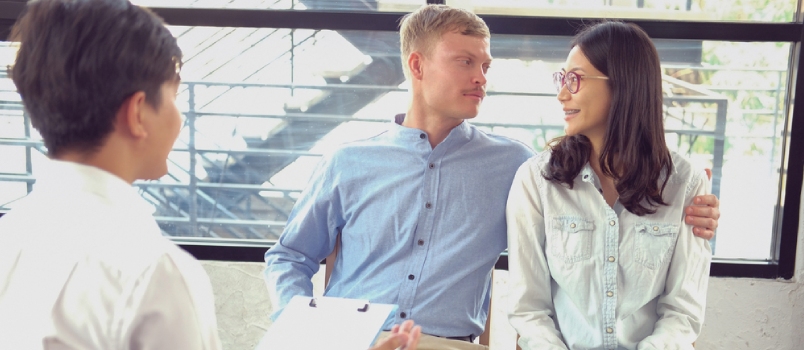 Psychologist Counselor Therapist Consulting Giving Relationship Advice To Couple.