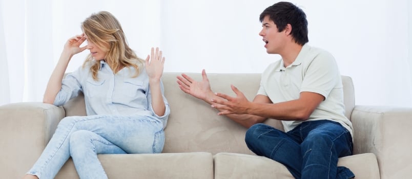 Men And Women Fighting Together Sitting On The Sofa