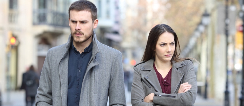 Front View Portrait Of An Angry Couple Walking In The Street After Argument