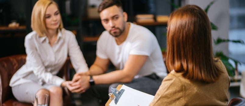 couple discussing relationship with a therapist