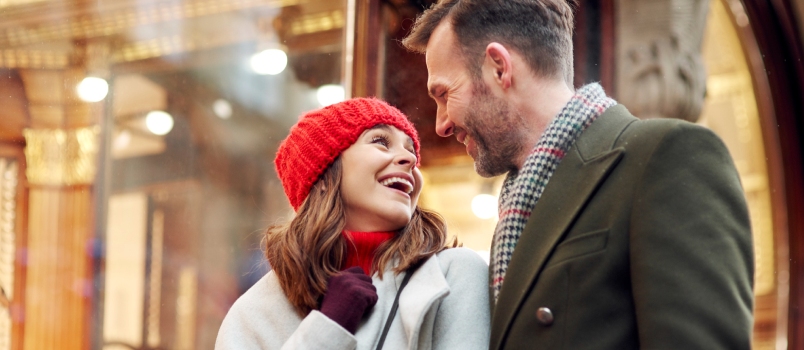 Romantic Moment During Big Winter Shopping Men And Women Looking Each Other And Smiling Happy Loving Couple Concept