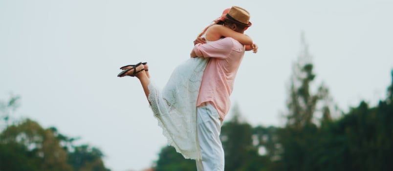 Woman In White Dress And Brown Hat Standing On Green Grass Field During Daytime