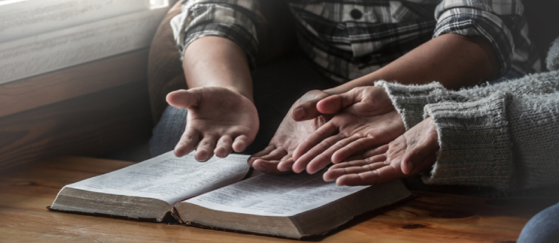 Two Christianity Sitting With Open Holy Bible and Reading