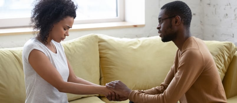 Loving African American Husband Hold Beloved Wife Hands Caressing Make Peace After Family Fight Or Misunderstanding