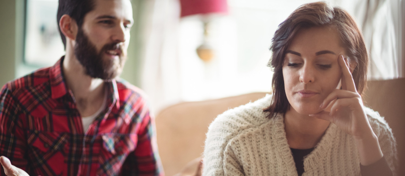 Couple Arguing Each Other In The Living Room At Home