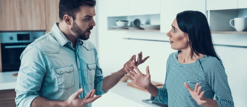 Young Couple Have Disagreement In Kitchen At Home Quarreling