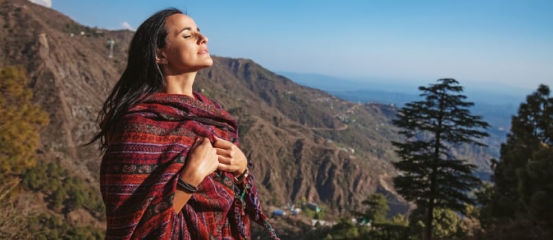 Beautiful Woman With Closed Eyes In Front Of Himalaya Mountains