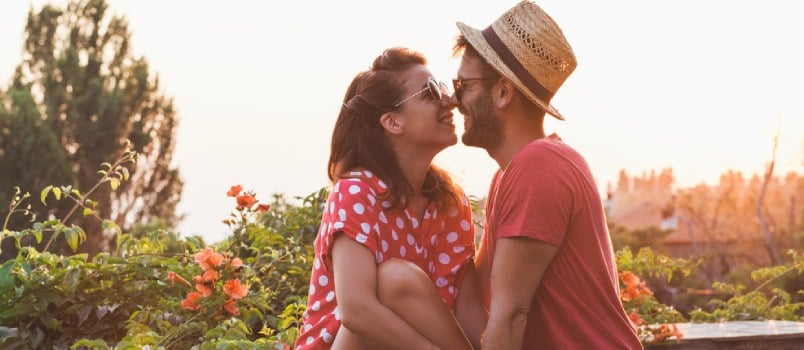 Loving Men And Women Catching Together On Terris Men Wearing Hunter Cap Women Smiling