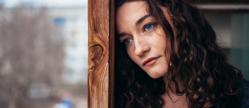 Beautiful Sad Lonely Girl Sitting Near The Window Is Missing