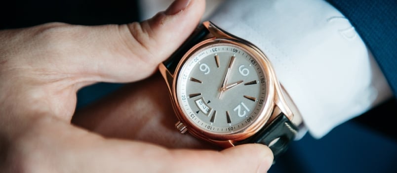 Businessman Looking At His Watch On His Hand, Watching The Time