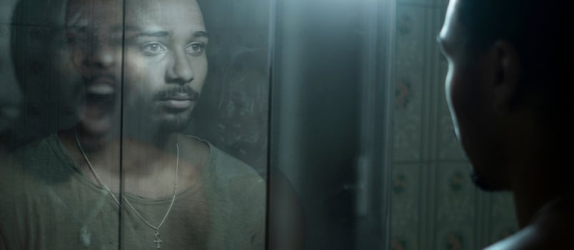 Man In Front Of A Mirror Observing His Deepest Fears