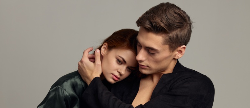 Man and woman standing showing love affection