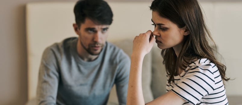 Upset Men And Women Sitting Sad On The Table