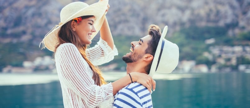 Young Attractive Men And Women Enjoying Honeymoon Trip