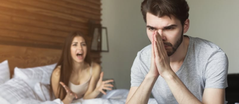 Unhappy Man Tired Of Shouting Woman In Bedroom