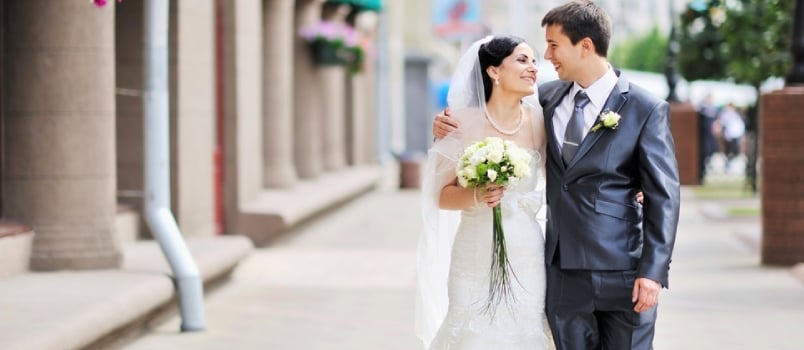 Bride And Groom Having Fun In An Old Town