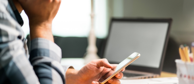 Lazy Worker Using Phone In Office Avoiding Work