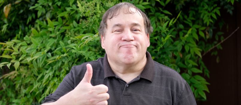 Autistic Man Looking at the Camera While Outdoors