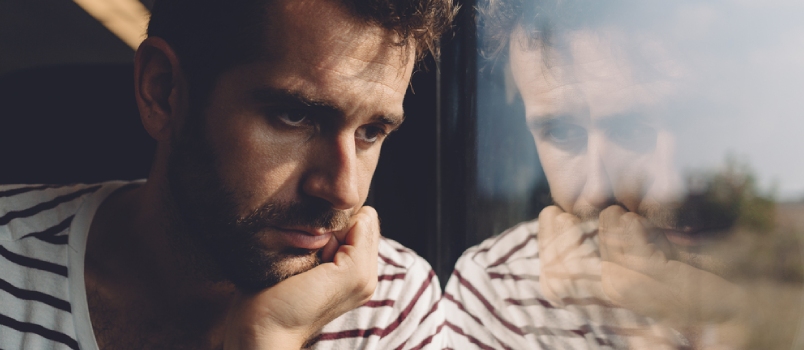 Upset Men Looking Away From the Window