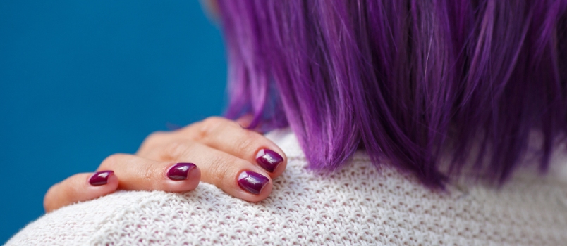 A Girl With Purple Hair Stands Back, Close-up of a Woman's Hand With a Beautiful Purple Manicure