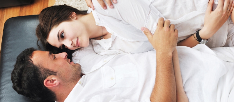 Happy Young Couple Relax at Modern Home Livingroom Indoor