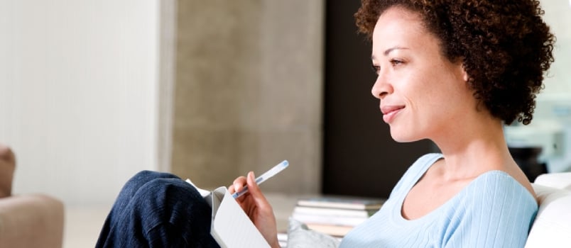 Woman Writing a Diary or Journal, Relaxing at Home
