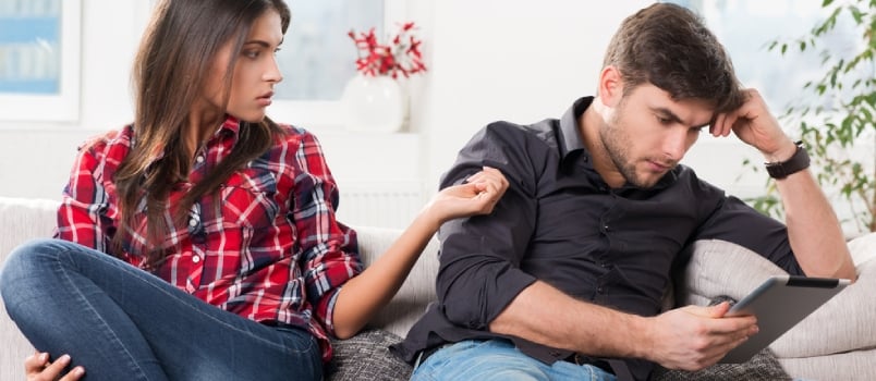 Young Couple in Conflict, Male With a Tablet in Hands