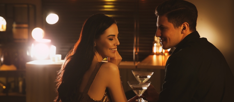 Man and Woman Flirting With Each Other in Bar