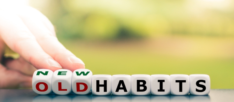 Hand Turns Dice and Changes the Expression "Old Habits" to "New Habits".