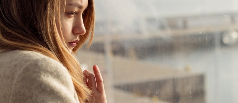 Beautiful Sad Lonely Girl Sitting Near the Window Is Missing