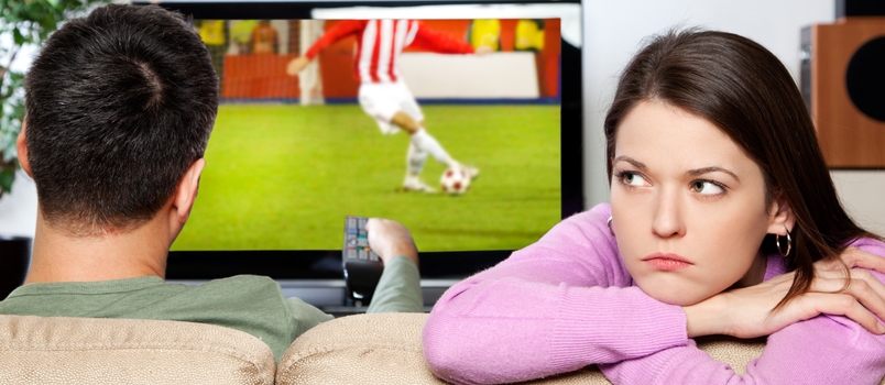 Image of Woman Getting Bored, While Her Partner Watching Sports I Am the Author of Image on Tv Screen